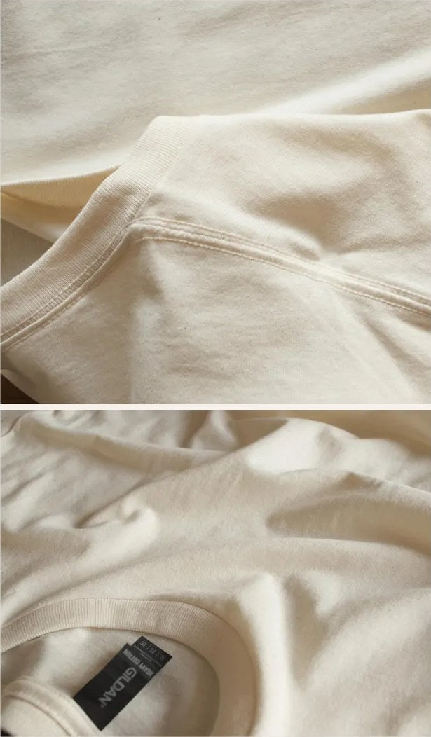 Close-up of the stitched shoulder seam and Gildan neck tag on a tee
